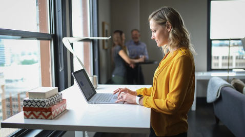Small business owner working on email campaigns at a laptop